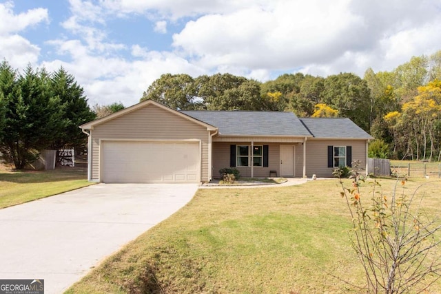 ranch-style home with a garage and a front lawn