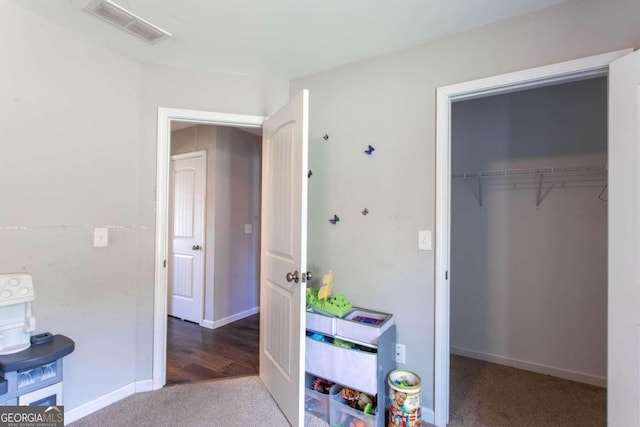 interior space with hardwood / wood-style flooring and a closet