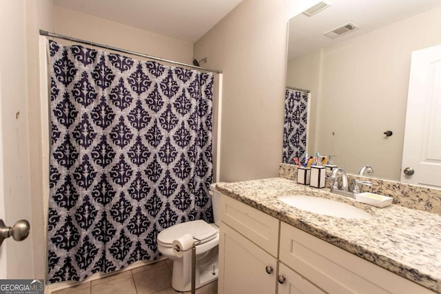 bathroom featuring toilet, curtained shower, vanity, and tile patterned floors