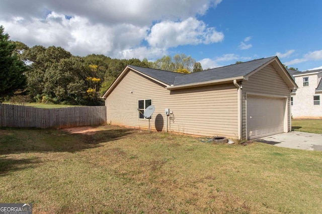 view of home's exterior with a lawn and a garage