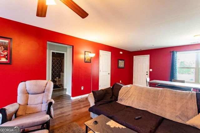 living room with hardwood / wood-style floors and ceiling fan