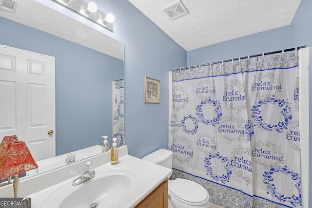 full bathroom with vanity, toilet, a textured ceiling, and shower / tub combo with curtain