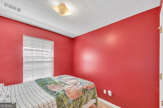 bedroom featuring a textured ceiling