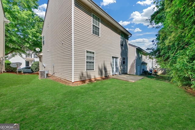 back of property featuring cooling unit, a patio, and a lawn