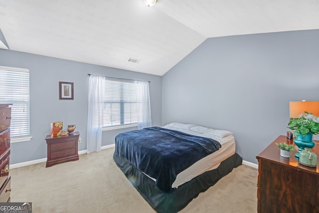 carpeted bedroom featuring vaulted ceiling