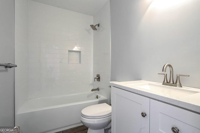 full bathroom featuring vanity, toilet, and tiled shower / bath combo