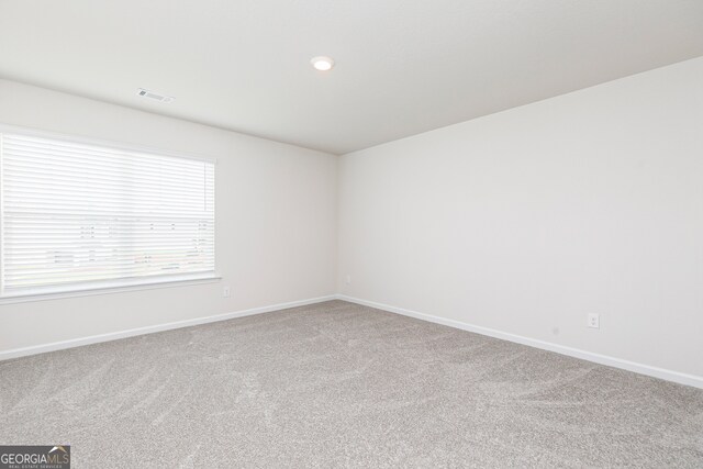 spare room featuring carpet flooring