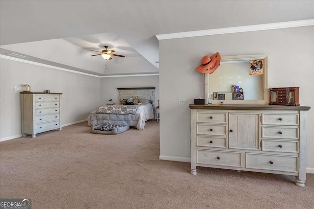 unfurnished bedroom with ceiling fan, light carpet, ornamental molding, and a raised ceiling