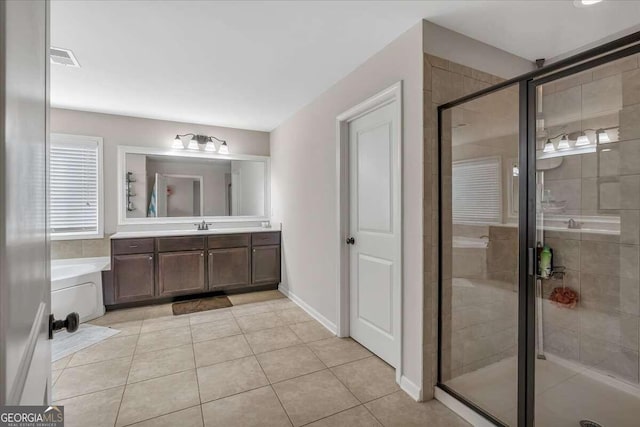 bathroom featuring vanity, tile patterned floors, and separate shower and tub