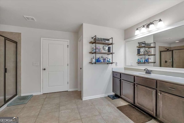 bathroom with vanity, tile patterned floors, and walk in shower