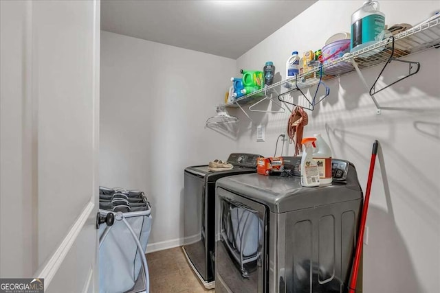 laundry room with washing machine and clothes dryer