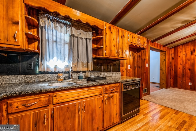 kitchen with wood walls, sink, dishwasher, light wood-type flooring, and beam ceiling