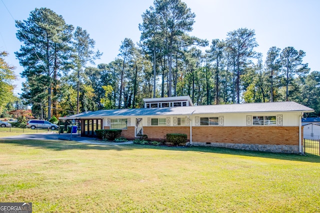 single story home with a front yard