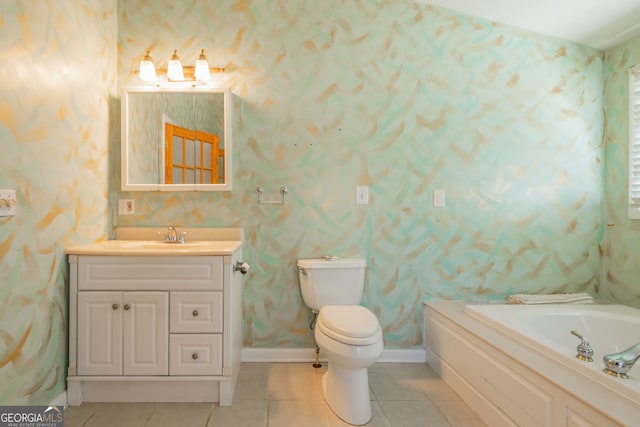 bathroom featuring vanity, tile patterned floors, toilet, and a bathing tub