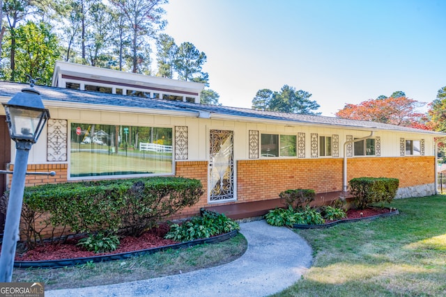 view of front of home with a front yard