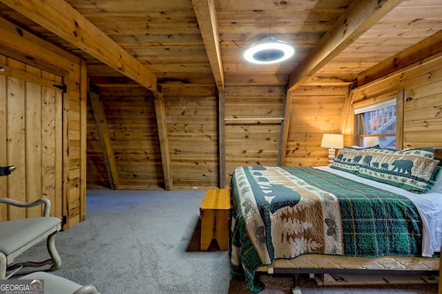 unfurnished bedroom featuring beam ceiling, wood walls, carpet, and wooden ceiling