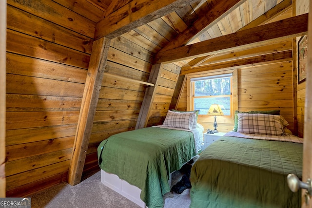 bedroom with wooden walls, vaulted ceiling with beams, carpet flooring, and wood ceiling