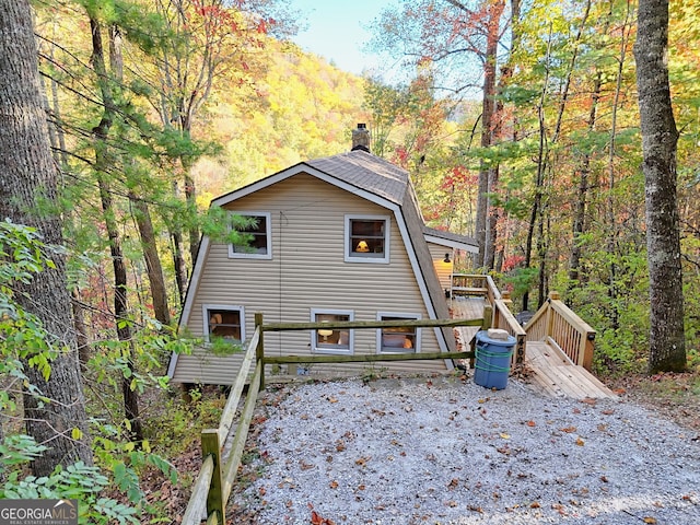 view of side of home featuring a deck