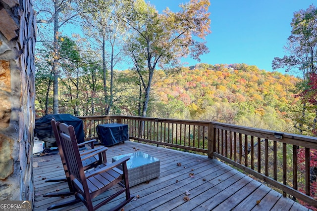 wooden deck featuring grilling area