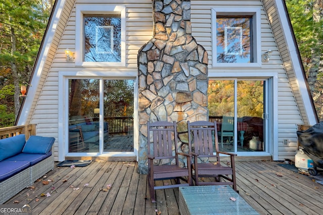 back of house with a wooden deck