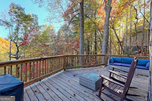 wooden deck featuring an outdoor hangout area