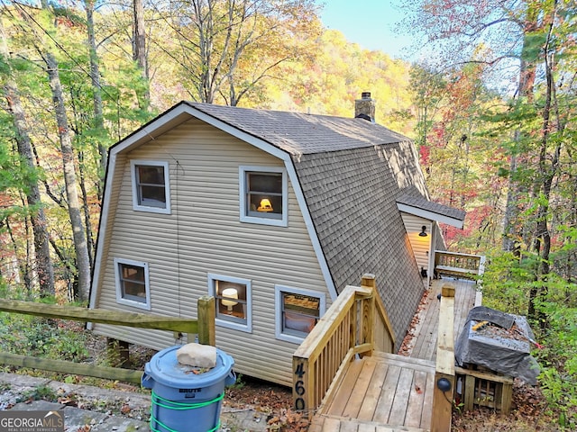 rear view of property with a deck