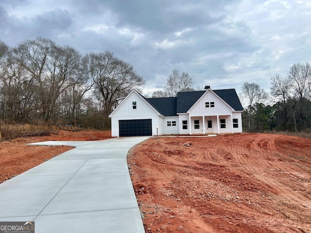 exterior space with a garage and covered porch