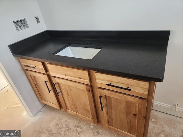 details featuring sink and concrete floors