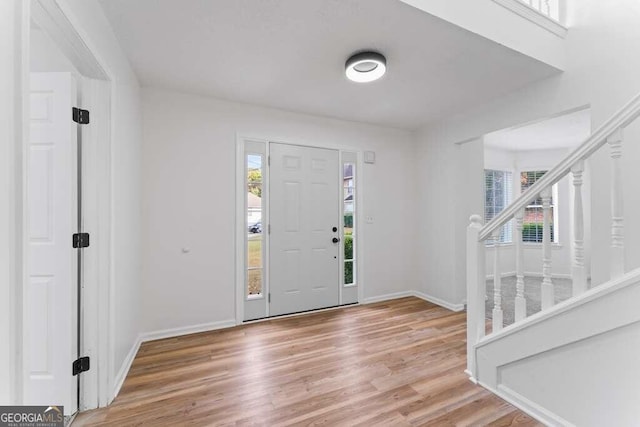 foyer entrance with light hardwood / wood-style flooring