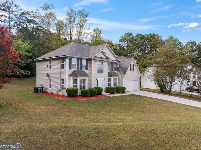 view of front of home featuring a front lawn, central AC unit, and a garage