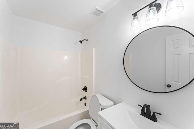 full bathroom with vanity, toilet, and shower / washtub combination