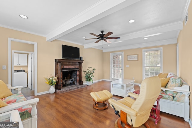 402 Brannen Dr, Statesboro, GA 30458 - living room with washer / clothes dryer, a fireplace, crown molding, recessed lighting, and wood finished floors