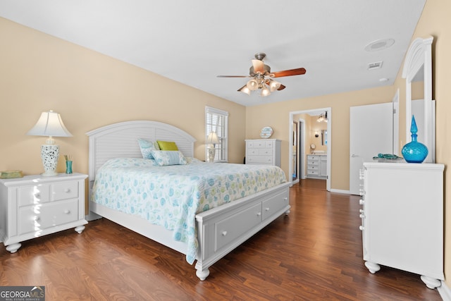 bedroom featuring ceiling fan, dark hardwood / wood-style flooring, and ensuite bathroom