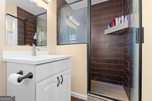 bathroom with vanity and an enclosed shower