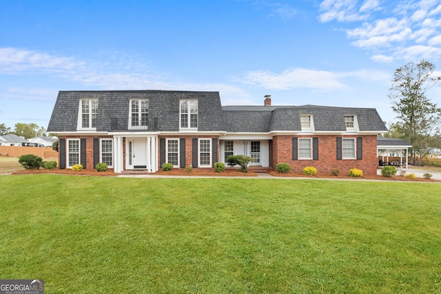 402 Brannen Dr, Statesboro, GA 30458 - view of front property featuring brick siding, mansard roof, roof with shingles, and a chimney