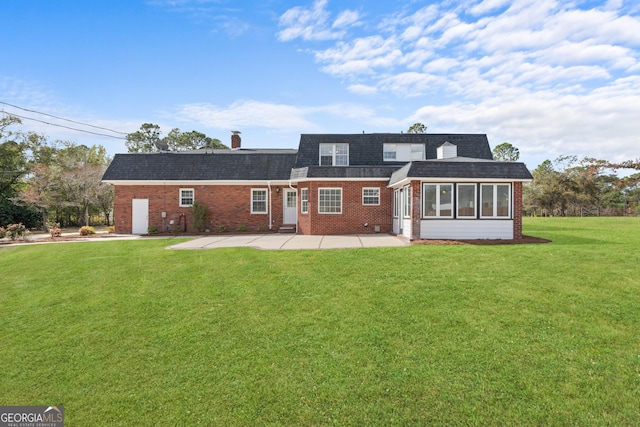 402 Brannen Dr, Statesboro, GA 30458 - back of house featuring brick siding, a patio area, a sunroom, a lawn, and a shingled roof
