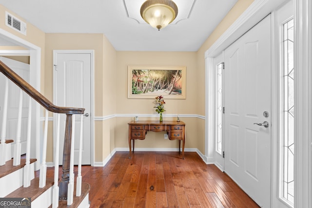 entryway with hardwood / wood-style flooring