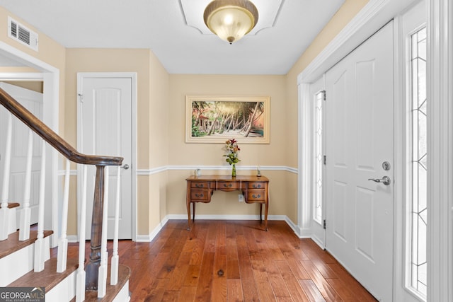 402 Brannen Dr, Statesboro, GA 30458 - foyer with stairs, baseboards, wood-type flooring, and plenty of natural light