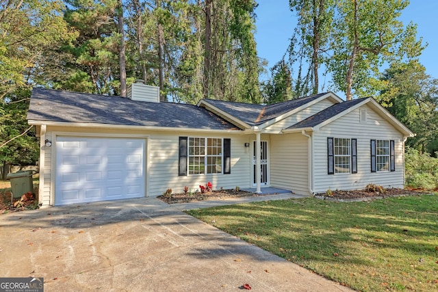 single story home with a front yard and a garage