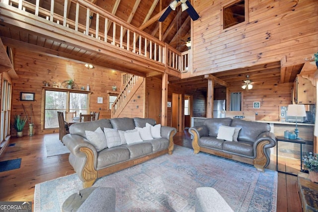 living room featuring wood ceiling, ceiling fan, high vaulted ceiling, and hardwood / wood-style floors