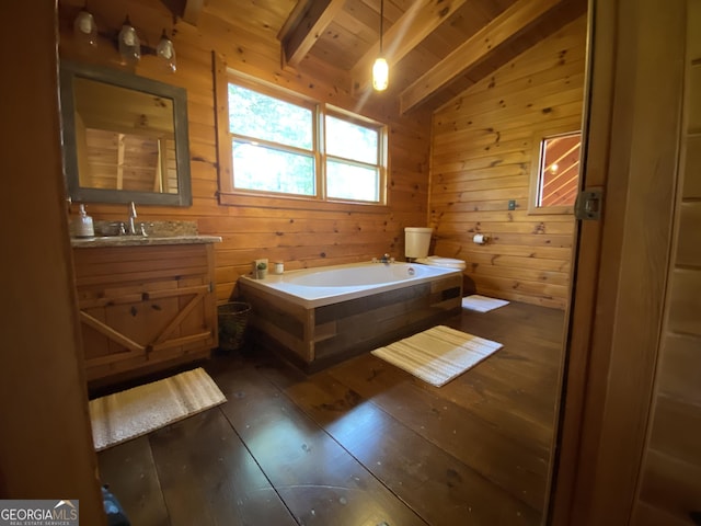 bathroom featuring hardwood / wood-style flooring, vanity, lofted ceiling with beams, wooden ceiling, and a tub