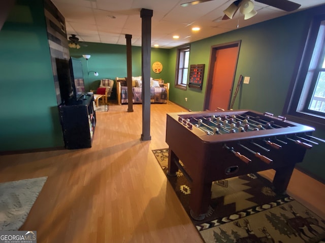 playroom featuring light hardwood / wood-style flooring and ceiling fan