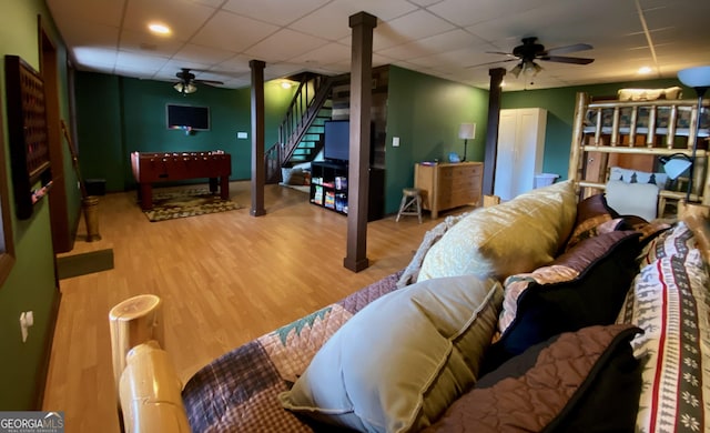 living room with hardwood / wood-style floors and ceiling fan