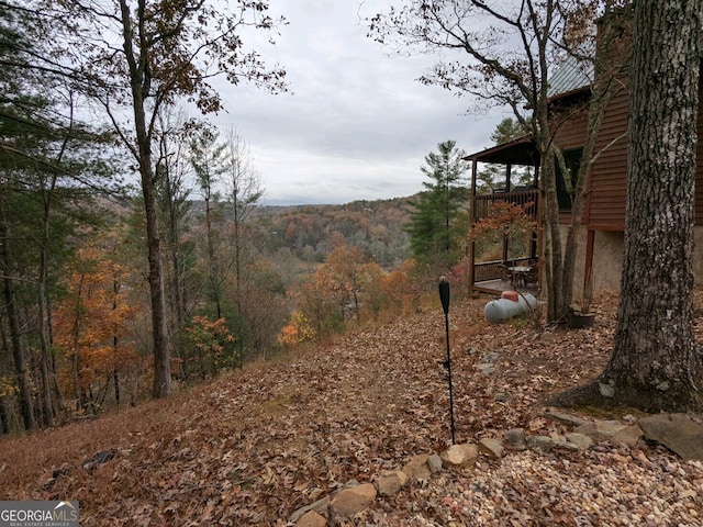 view of yard with a forest view