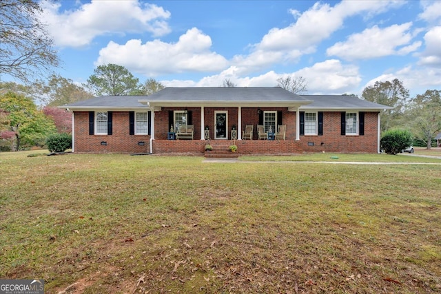 ranch-style home with a front lawn and a porch