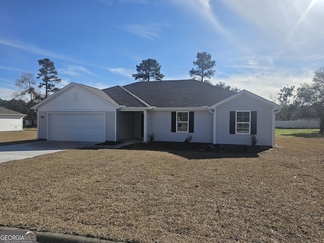 ranch-style home with a garage and a front yard