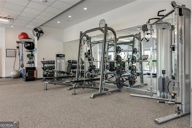 workout area with a paneled ceiling