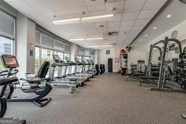 gym featuring a paneled ceiling