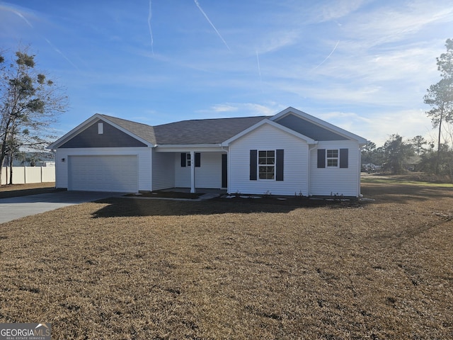 ranch-style house with a garage and a front yard