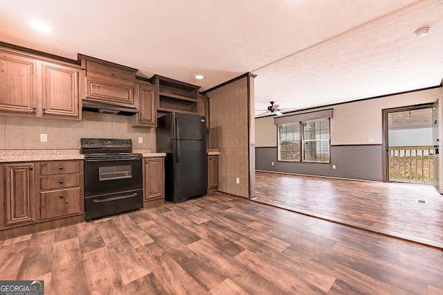 kitchen featuring ceiling fan, extractor fan, ornamental molding, dark hardwood / wood-style floors, and black appliances